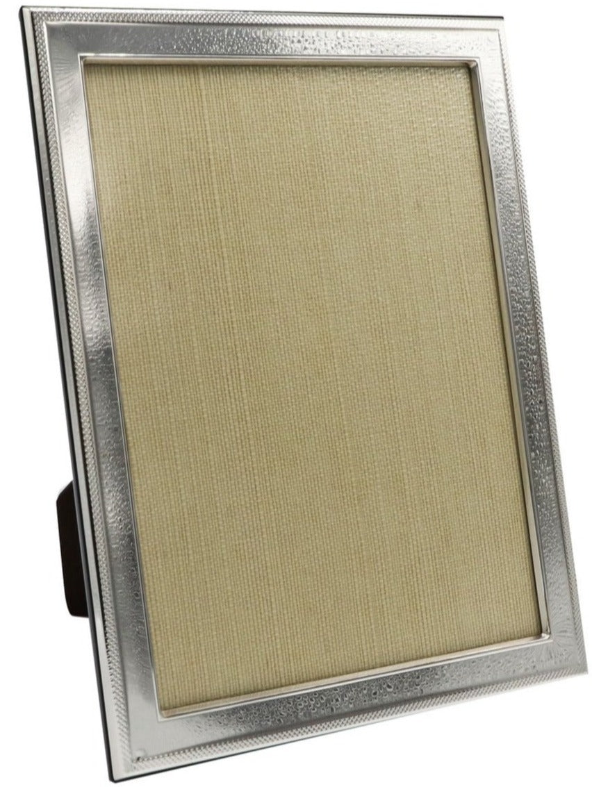 The Sterling Frame with Border Collection by Tizo Design features a sterling silver frame with a mesh border and blank textured beige insert, shown standing upright against a white background.