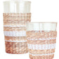Two clear glass tumblers from Be Home's Seagrass White Stripe Glassware Collection, wrapped with woven seagrass and white stripes, are displayed side by side, adding a stylish accent to your table.