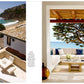 Left: Patio with table overlooking a sandy beach and cliffs, featuring elements of traditional architecture. Right: Covered outdoor seating area with ocean view, white walls, and blue-accented cushions that reflect classic California architecture—spaces inspired by the design vision in *Shaping the World As A Home* from Rizzoli.