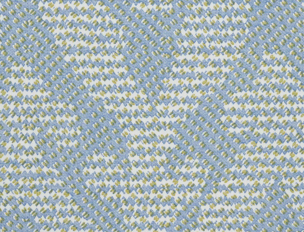 Close-up of the Empire Ottoman by Bunny Williams in Blue Grande Gran, featuring a textured woven fabric with light blue, white, and yellow geometric diamond patterns—perfect as an accent piece for your bedroom retreat.