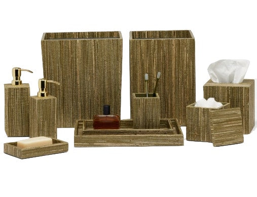 A set of coordinated Pigeon & Poodle Sumter Collection bathroom accessories with a textured finish, including a soap dispenser, toothbrush holder, tissue box cover, and other containers.