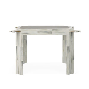 The Compositions Game Table by Century Furniture features a patchwork design, four sturdy legs, a smooth grayish-white tabletop, and elegant faux horn accents for added sophistication.