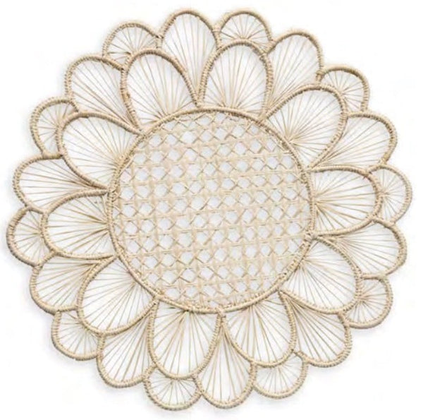 A handcrafted circular lace doily from the Themis Z Symi Rattan Placemat Collection with a floral design and scalloped edges.
