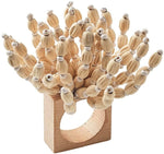 The Kim Seybert Reed Napkin Ring features multiple short wooden dowels, each topped with a small white bead, making it perfect for adding coastal-inspired style to your table setting.