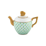 The Herend Tea Pot features durable porcelain with a gold handle, spout, and lid, and is hand painted with a green and blue scale pattern on white.