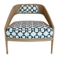 A modern Tenan Lounge Chair in Broadway featuring a patterned cushion and backrest with geometric black and white shapes, available in the Matte Sand Dune finish from McGuire Furniture.