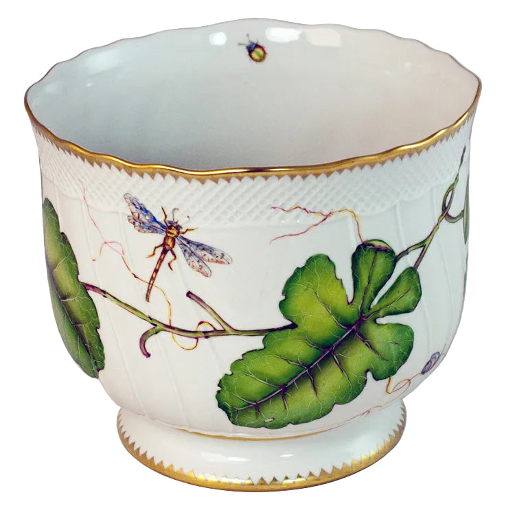 The Anna Weatherley Leaf Cachepot is a white porcelain cachepot with a gold rim, hand painted with green leaves, a dragonfly, and a small insect in exquisite Hungarian style.