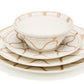 Themis Z’s Serenity Beige Dinnerware Collection includes a hand-painted bowl, salad plate, and handcrafted dinner plate featuring cream ceramic with tan wavy line and dot accents.