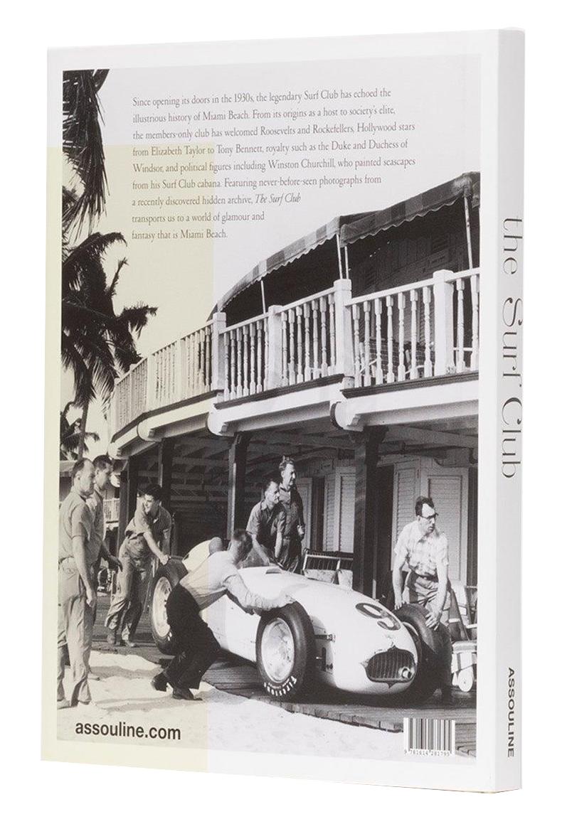 A black and white image on the cover of "The Surf Club" by Assouline depicts a vintage race car alongside people dressed in 1950s style attire, set against the backdrop of a building. This book encapsulates the luxury and allure of Miami's golden era.