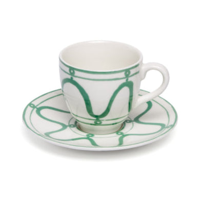 White ceramic cup and saucer with green decorative patterns from the Serenity Green Dinnerware Collection by Themis Z, set against a plain white background.