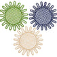 Three round coasters from the Kyma Rattan Placemat Collection by Themis Z, handcrafted by Colombian artisans, are shown in green, navy blue, and beige with radiating loops, arranged in a triangular pattern on a white background.