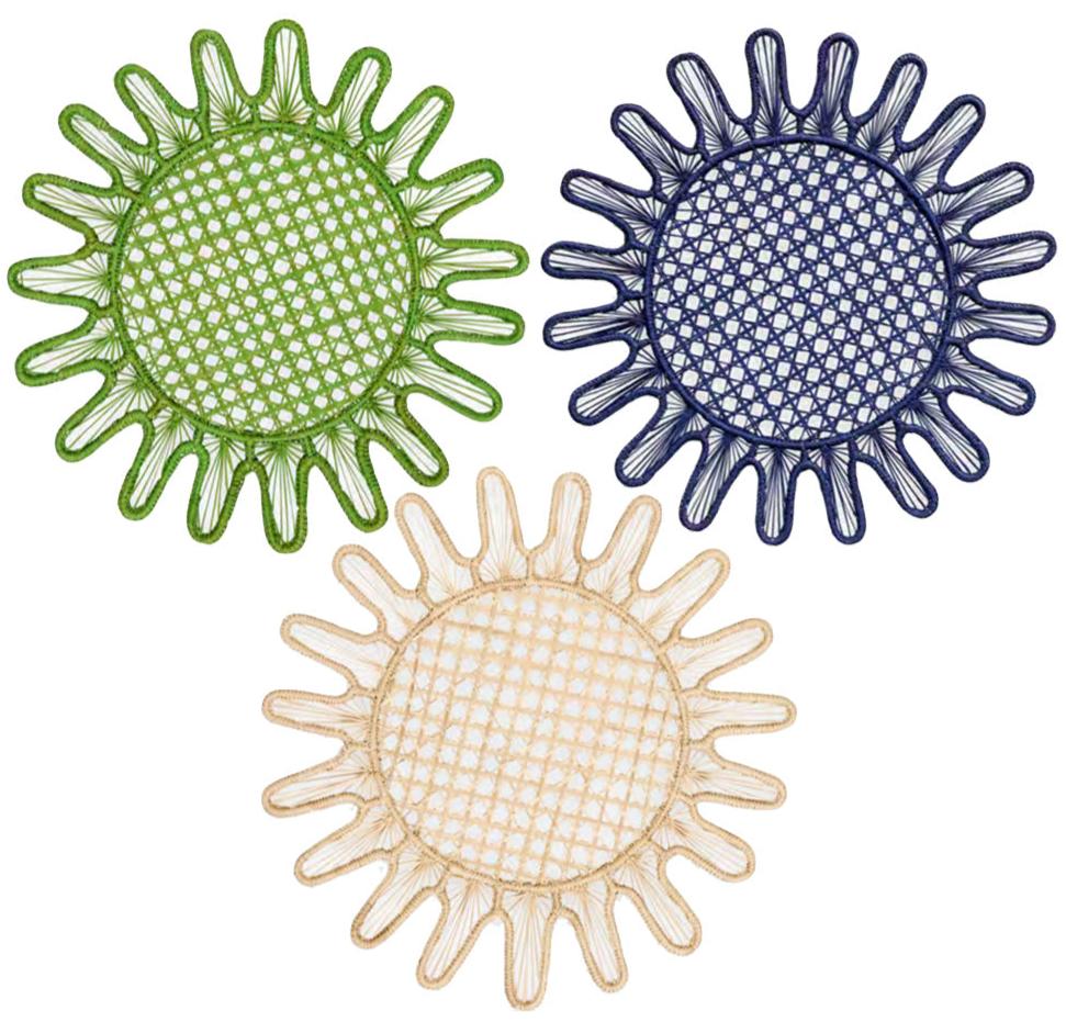 Three round coasters from the Kyma Rattan Placemat Collection by Themis Z, handcrafted by Colombian artisans, are shown in green, navy blue, and beige with radiating loops, arranged in a triangular pattern on a white background.