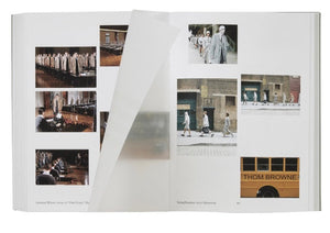 The Phaidon Thom Browne book lies open, revealing fashion model photos in coordinated outfits and a yellow bus marked "Thom Browne," with partially turned pages showcasing striking fashion photography.