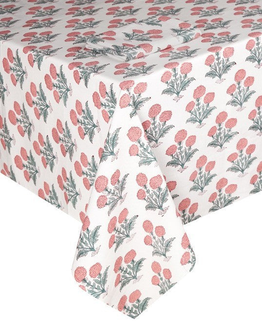 The Poppy Table Linen Collection by SLOANE BY HAND features a rectangular white tablecloth adorned with red flowers and green leaves, inspired by traditional hand block printing for classic elegance.