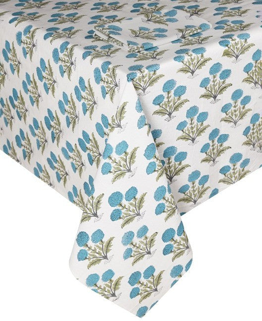 The Poppy Table Linen Collection by SLOANE BY HAND features a rectangular tablecloth adorned with blue and green thistle flowers in a hand block printed design—a charming upgrade for your table décor.