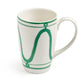 White ceramic mug from Themis Z Serenity Green Dinnerware Collection, featuring green wavy line and circle patterns on the exterior, displayed on a plain white background.