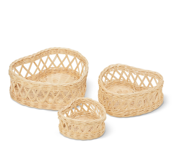 The AERIN Wicker Heart Basket Set by Aerin features three handcrafted baskets of varying sizes with open lattice designs, all displayed against a white background.