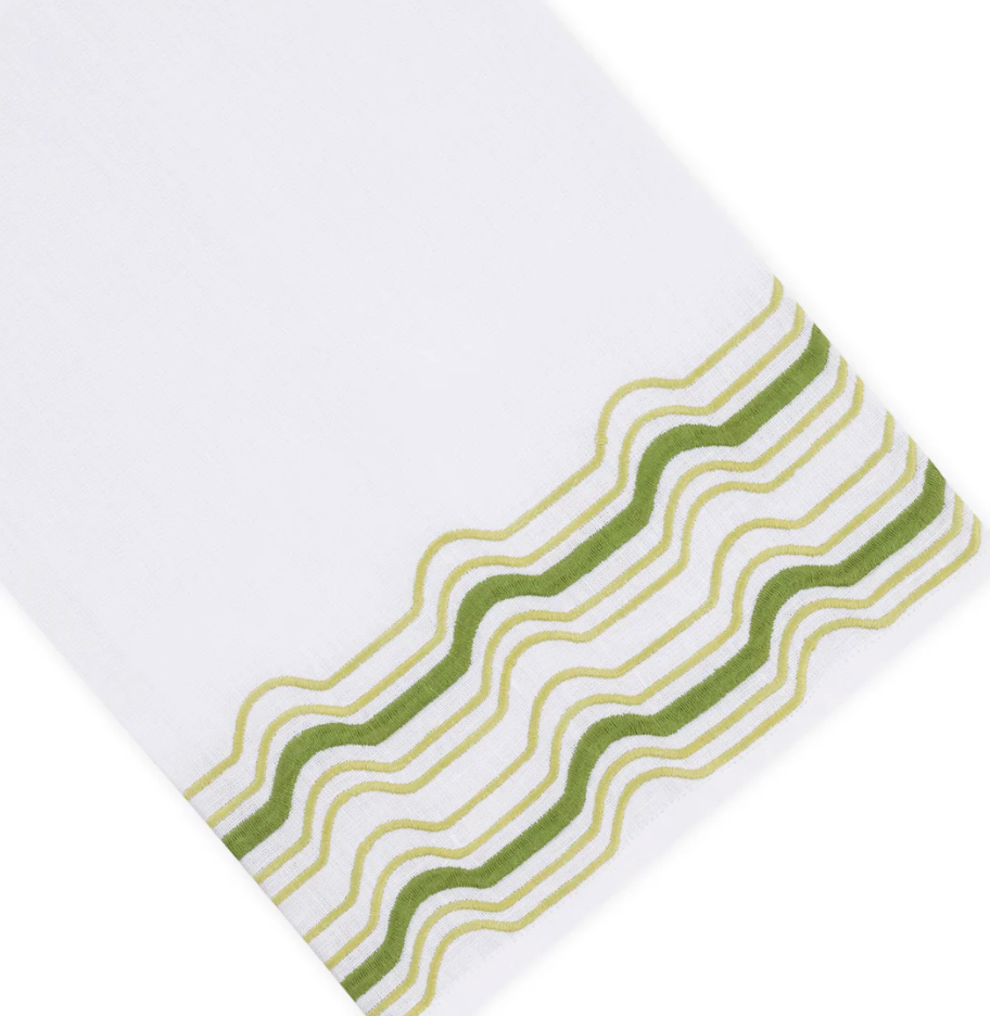 Mod Bath Collection white Italian linen hand towel with embroidered green wavy lines at one end.