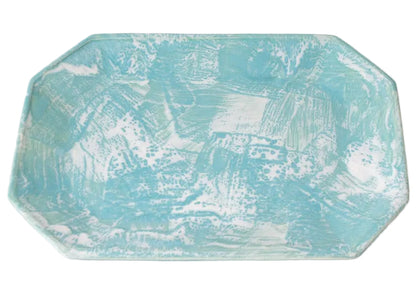 The Brushstroke Tray Collection by Paul Schneider Ceramics features rectangular aqua and white ceramic trays with abstract, brushstroke patterns and unique glaze schemes.