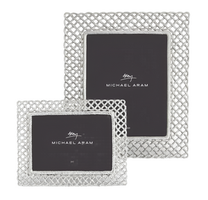 Two silver frames from the Michael Aram Love Knot Frame Collection, one rectangular and one square, are displayed side by side with black inserts, symbolizing unity and connectedness.