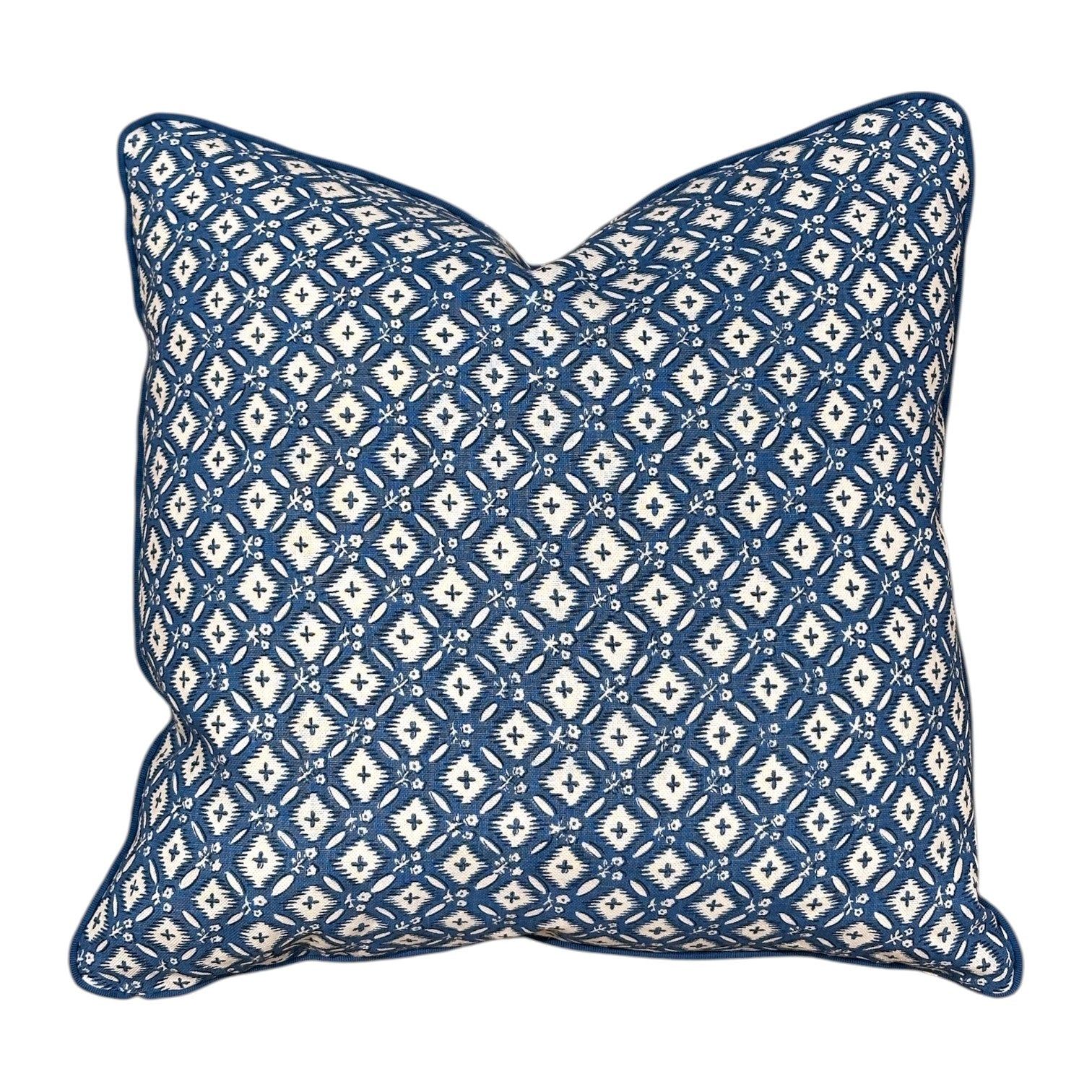 The Tripura Woad Blue Pillow by Hive Custom Pillows features a blue and white geometric diamond pattern, expertly crafted for a luxurious touch to your decor.