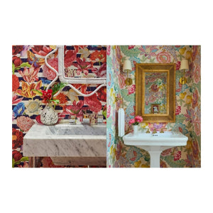 Two Tropical Living bathroom vanities featuring bold floral wallpaper, marble sinks, and decorative mirrors in a tropical interior design style by Abrams.