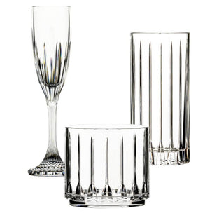 The Tryst Acrylic Drinkware Collection by Bold features a champagne flute, highball, and lowball glass with vertical cut patterns, combining glassware elegance and unbreakable durability—all displayed on a white background.