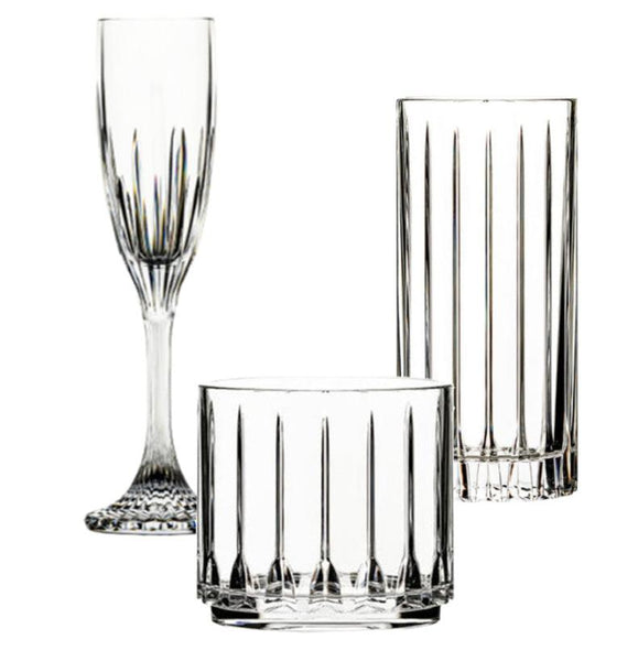 The Bold Tryst Acrylic Collection by Bold includes three elegant glassware items: a champagne flute, a tall tumbler, and a short tumbler, each with vertical line patterns. Made from high-quality polycarbonate for unbreakable durability, they blend beauty with resilience.