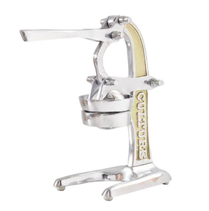 The Verve Culture Citrus Juicer is a metal manual juicer with a lever and a sturdy base, featuring “CULTURE” embossed on the side—an essential for any kitchen, perfect for making fresh juice for your favorite cocktails.