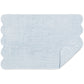 The Matouk Cairo Scallop Bath Collection features a light blue rectangular bath mat with scalloped edges, shown on a white background with a corner flipped to display the underside, pairing beautifully with our luxury bath towels.