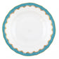 The Herend Fish Scale Turquoise Collection features a white porcelain plate with scalloped edges, adorned with a hand-painted turquoise and gold border for an elegant touch.