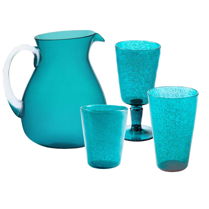 From the Memento Turquoise Acrylic Drinkware Collection, this durable turquoise pitcher with handle sits beside three matching speckled glasses—including one stemmed—ideal for outdoor dining or casual gatherings.