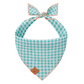 The Foggy Dog Hoppy Easter Reversible Dog Bandana features blue and white checks with a tan border, a knotted top, and a small brown "M" tag.