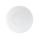 A plate from the Bernardaud Twist White Collection, featuring a textured geometric rim inspired by Japanese design, is shown from above against a plain white background.