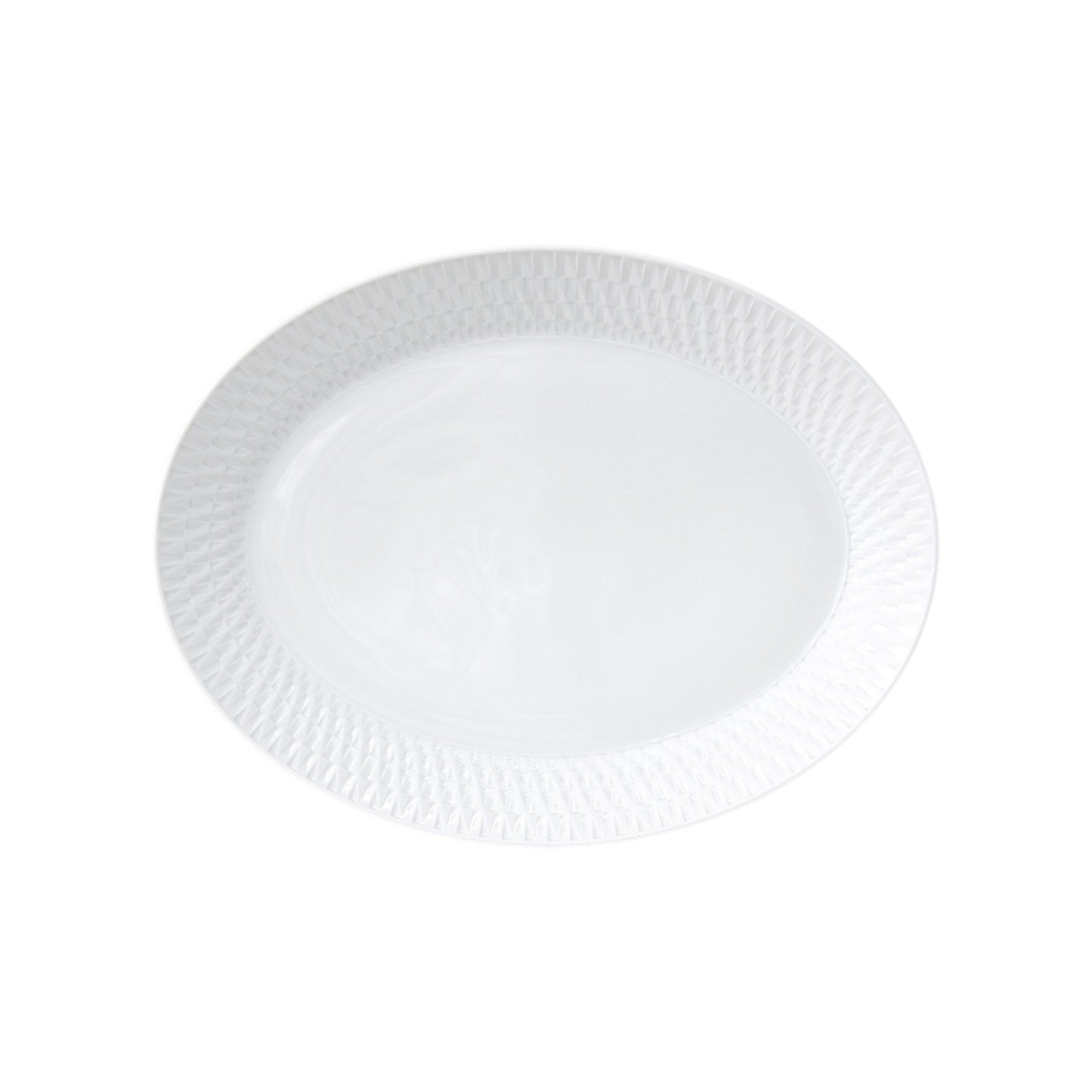 The Twist White Collection by Bernardaud features a white oval ceramic plate with a textured rim and subtle geometric pattern, inspired by Japanese design, photographed on a plain white background.