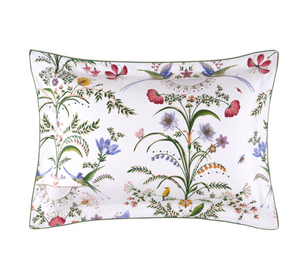 Rectangular organic cotton sateen pillowcase from the Botanic Bedding Collection by Yves Delorme, featuring a white background with a colorful botanical print of flowers, birds, and insects.