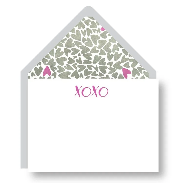 Haute Papier's XOXO Notes Set includes a white letterpress notecard with "XOXO" in pink and a matching envelope lined with gray and pink hearts.