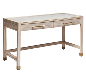 The Jensen Desk by Interlude Home features a rectangular wooden design with a light finish, two front drawers with knobs, a flat tabletop, and gold-capped feet—an elegant addition to any workspace.