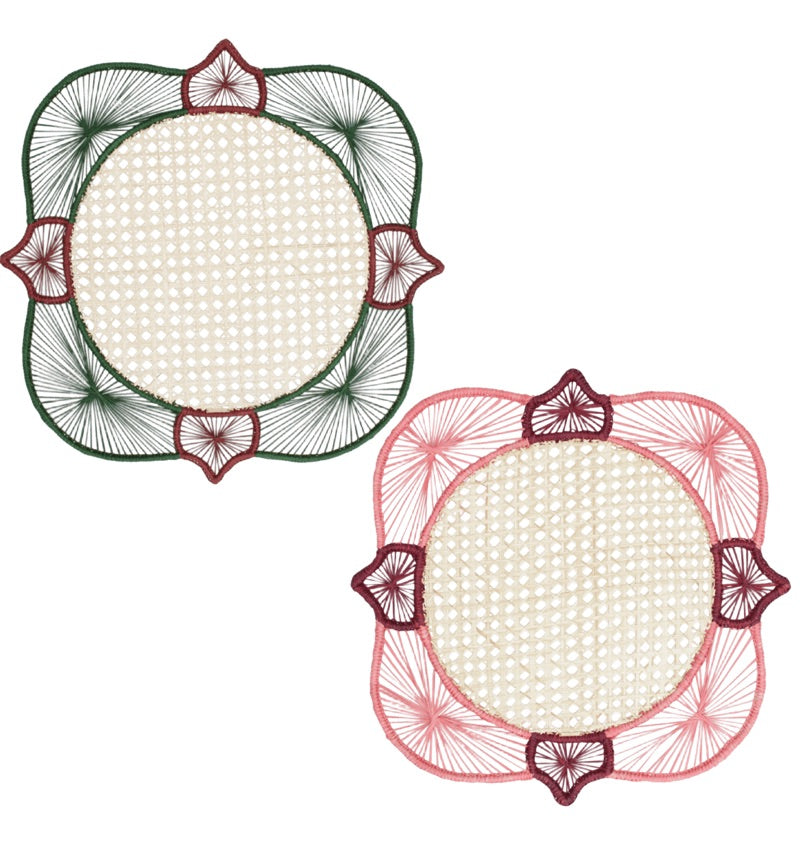 From the Lily & Heliconia Placemat Collection by Mercedes Salazar, this pair of square doilies features rounded corners and showcases thread patterns radiating from circular beige centers—one intricately woven in green and red, the other in pink and red—evoking the vibrant artistry found in traditional Colombian placemats and handwoven raffia designs.