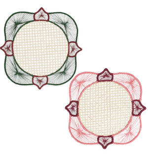 From the Lily & Heliconia Placemat Collection by Mercedes Salazar, this pair of square doilies features rounded corners and showcases thread patterns radiating from circular beige centers—one intricately woven in green and red, the other in pink and red—evoking the vibrant artistry found in traditional Colombian placemats and handwoven raffia designs.