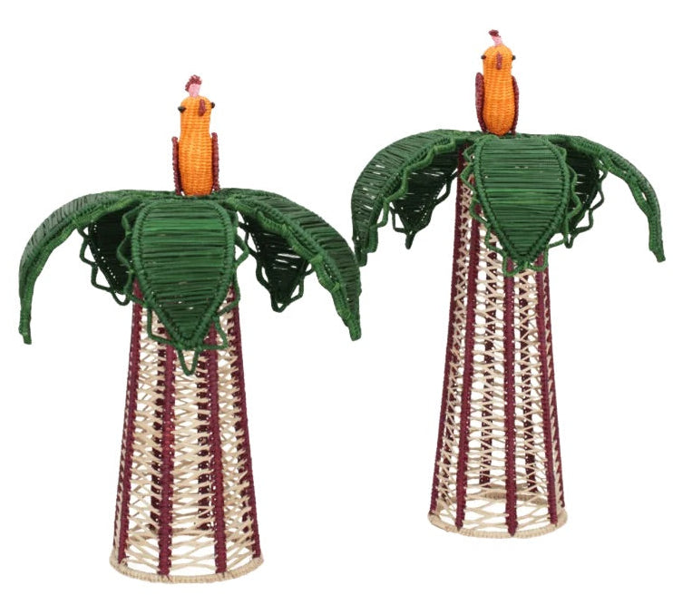 Bring distinctive charm to your dining table with the Hoatzin Palm Candle Holder & Flower Vase by Mercedes Salazar. This pair of woven decorative figures features bird-like forms perched on tall, cone-shaped bases, complete with green leaf-inspired wings and vibrant orange heads. Handcrafted with natural raffia for a vase-inspired design, these pieces serve as eye-catching decor—pair them with a battery-operated votive candle to create a warm and inviting ambiance.