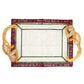 Introducing the Monkey Jungle Party Tray by Mercedes Salazar—a handwoven raffia fiber rectangular tray adorned with vibrant red and green borders, and accented by two yellow monkey figures at opposite corners serving as whimsical handles. This delightful piece adds a playful charm to any dining setting.