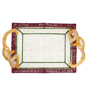 Introducing the Monkey Jungle Party Tray by Mercedes Salazar—a handwoven raffia fiber rectangular tray adorned with vibrant red and green borders, and accented by two yellow monkey figures at opposite corners serving as whimsical handles. This delightful piece adds a playful charm to any dining setting.