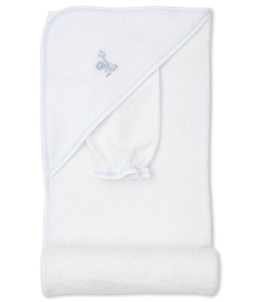 A white 100% Cotton Kissy Kissy baby blanket with light blue trim and an embroidered design of a stork carrying a bundle.