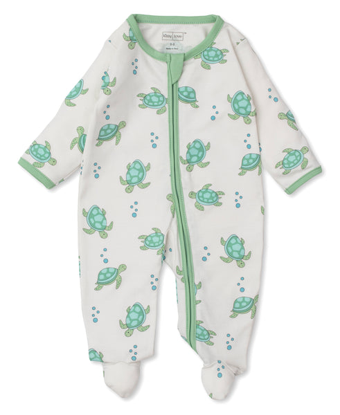 A white baby sleepsuit, made of Pima cotton, with Kissy Kissy's Playful Turtles Zip Footie on it.
