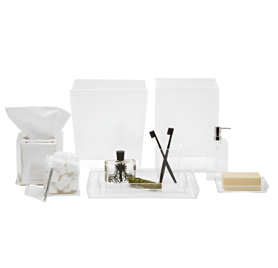 A minimalist setup from the Pigeon & Poodle Monette Bath Collection includes acrylic bath accessories like containers, a soap dispenser, toothbrush holder, tissue box, cotton balls, and a tray with a bottle and leaf.