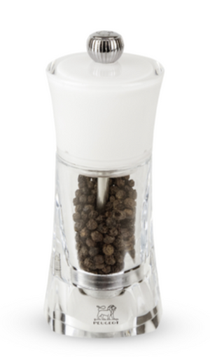 A Peugeot Saveurs Molene Acrylic/White Salt and Pepper Mill with Matte Gold Button Collection with black beans in it.