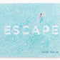 Abrams Escape hardcover photography book featuring an aerial photograph of a person swimming in blue water.