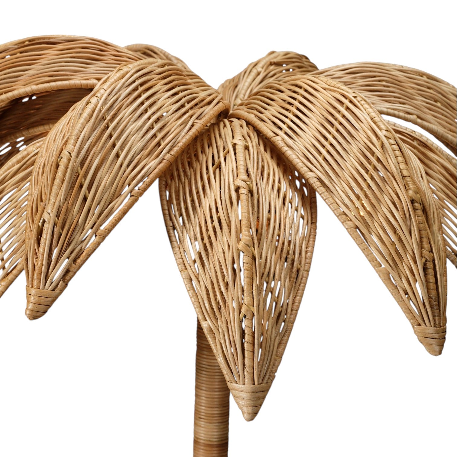 Close-up of the Made Goods Solana Floor Lamp, featuring intricately woven rattan in a palm leaf design, set against a white background.