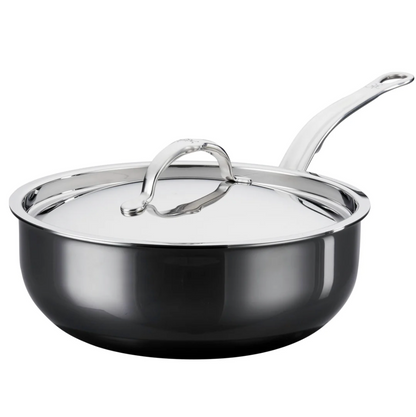 A Hestan NanoBond Titanium Essential Pan, 5qt, with a lid and long handle, metal utensil safe, is shown on a plain white background.